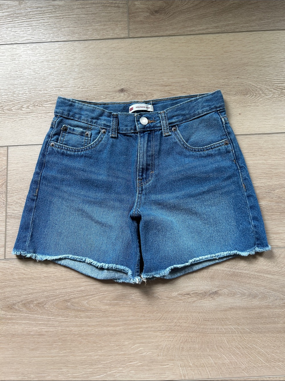 Levi's Medium Blue Frayed Hem Denim Shorts